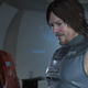 El nivel de detalle de los gráficos de Death Stranding es impresionante. En la imagen podemos ver a Sam, interpretado por Norman Reedus, y el personaje que luce como Guillermo del Toro.